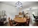 Eat-in kitchen showcasing a wooden table, chairs, and updated lighting at 407 Doris Dr, Woodstock, GA 30188