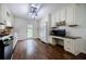 This kitchen includes stainless appliances and dedicated desk space, blending functionality with modern amenities at 407 Doris Dr, Woodstock, GA 30188