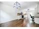 Expansive kitchen with white cabinets, modern appliances, and plenty of space for a dining area or office at 407 Doris Dr, Woodstock, GA 30188