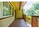 Inviting exterior porch with wood decking and natural light at 407 Doris Dr, Woodstock, GA 30188