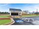 Community mailboxes and accessible van parking on a sunny day offer convenience to residents at 318 Sound Cir, Stockbridge, GA 30281