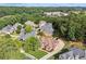 Aerial view of a luxury home featuring manicured landscaping and beautiful trees at 3410 Enclave Mill Ct, Dacula, GA 30019