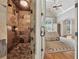 Elegant bathroom featuring a large tiled shower with glass door and a glimpse into the bedroom at 3410 Enclave Mill Ct, Dacula, GA 30019