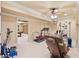 Home gym or exercise room featuring ceiling fan and view into billiards room at 3410 Enclave Mill Ct, Dacula, GA 30019