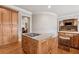 Stylish kitchen island boasts granite counters and stainless appliances, opening to other rooms at 3410 Enclave Mill Ct, Dacula, GA 30019