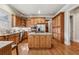 Spacious kitchen featuring granite countertops, stainless steel appliances, and hardwood floors at 3410 Enclave Mill Ct, Dacula, GA 30019