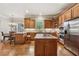 Gourmet kitchen showcasing a center island, breakfast bar, and stainless steel appliances at 3410 Enclave Mill Ct, Dacula, GA 30019