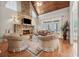 Living room with stone fireplace, hardwood floors, and comfortable furniture at 3410 Enclave Mill Ct, Dacula, GA 30019