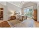 Vaulted ceiling main bedroom features a large window, neutral carpet, and natural light at 3410 Enclave Mill Ct, Dacula, GA 30019