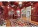 Luxurious office with wood-paneled walls, fireplace, and large window at 3410 Enclave Mill Ct, Dacula, GA 30019