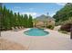 Backyard pool and patio, perfect for outdoor entertaining and relaxation on sunny days at 3410 Enclave Mill Ct, Dacula, GA 30019