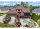 Beautiful brick home with a pool, screened in porch, and three car garage at 3410 Enclave Mill Ct, Dacula, GA 30019