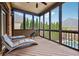 Relaxing screened porch with wooded views, comfortable furniture, and connection to pool at 3410 Enclave Mill Ct, Dacula, GA 30019