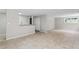 Basement area with tile flooring, neutral paint, and a serving counter with sink at 103 Seabolt Dr, Locust Grove, GA 30248