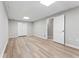 Finished basement area featuring wood-look flooring, neutral paint, and a large closet for ample storage at 103 Seabolt Dr, Locust Grove, GA 30248