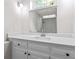 Bathroom with a white vanity, large mirror, and modern shower with white tiles at 103 Seabolt Dr, Locust Grove, GA 30248