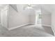This bedroom features neutral decor, a ceiling fan, a closet, and natural light at 103 Seabolt Dr, Locust Grove, GA 30248