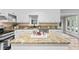Bright kitchen with granite counters, stainless steel appliances, and white cabinets at 103 Seabolt Dr, Locust Grove, GA 30248