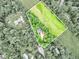 Aerial view of a wooded property highlighting the home's location, yard, and surrounding landscape at 135 Crimson Rdg, Tyrone, GA 30290
