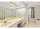 Bright bathroom featuring a large double sink vanity and a separate tub at 135 Crimson Rdg, Tyrone, GA 30290