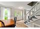 Bright entry featuring stairs to the second floor, a stained-glass front door and wood-look flooring at 135 Crimson Rdg, Tyrone, GA 30290