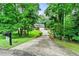 Charming single-Gathering home with mature landscaping, long drive, and attached two-car garage at 135 Crimson Rdg, Tyrone, GA 30290