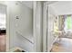 Hallway with multiple access doors to rooms and a view of a study space at 135 Crimson Rdg, Tyrone, GA 30290