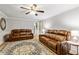 Comfortable living room with two leather sofas and stylish decor at 135 Crimson Rdg, Tyrone, GA 30290