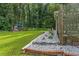 View of the side yard featuring a small shed and lush green lawn at 1738 Sherry Ln, Jonesboro, GA 30236