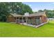 Well maintained yard with brick house and a patio with privacy lattice at 1738 Sherry Ln, Jonesboro, GA 30236