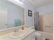 Bathroom featuring a neutral sink and vanity, toilet, and shower with curtain at 1738 Sherry Ln, Jonesboro, GA 30236