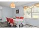 Bright dining room with updated flooring, a modern light fixture, and a large window at 1738 Sherry Ln, Jonesboro, GA 30236