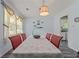 Light and airy dining room featuring a long table and view into kitchen at 1738 Sherry Ln, Jonesboro, GA 30236