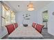Bright dining room with long table, neutral walls, and view of the backyard at 1738 Sherry Ln, Jonesboro, GA 30236