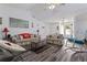 Spacious living room with wood floors and comfortable floral furniture at 1738 Sherry Ln, Jonesboro, GA 30236