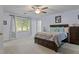 Bedroom featuring carpet, neutral colors, natural light, and traditional furnishings at 1738 Sherry Ln, Jonesboro, GA 30236