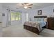 Main bedroom with natural light and ceiling fan at 1738 Sherry Ln, Jonesboro, GA 30236