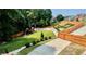 Private backyard with a well-maintained lawn, charming play area, and new wood fence at 3499 Lake Mill Rd, Buford, GA 30519