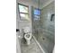 Contemporary bathroom featuring a glass-enclosed shower, subway tile, and modern fixtures at 3499 Lake Mill Rd, Buford, GA 30519