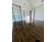 Bright bedroom with beautiful hardwood floors and built-in shelving and natural light at 3499 Lake Mill Rd, Buford, GA 30519