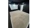 A cozy home theater with a large projection screen, comfortable carpeting, and dimmable recessed lighting at 3499 Lake Mill Rd, Buford, GA 30519