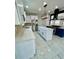 Bright kitchen with stainless steel appliances, a central island, and white cabinetry at 3499 Lake Mill Rd, Buford, GA 30519