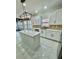 Modern kitchen with white cabinets, an island, and stainless steel appliances at 3499 Lake Mill Rd, Buford, GA 30519