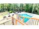 Overhead shot of a sparkling pool with lush landscaping and comfortable outdoor seating area at 3499 Lake Mill Rd, Buford, GA 30519