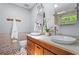 Modern bathroom featuring double vessel sinks, wood cabinets, and stylish stone tile accents at 970 Pine Grove Pointe Dr, Roswell, GA 30075