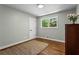 Bright bedroom with hardwood floors, large windows, and ample natural light, creating a serene atmosphere at 970 Pine Grove Pointe Dr, Roswell, GA 30075