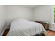 Cozy bedroom featuring plush bedding and hardwood floors, creating a peaceful retreat at 970 Pine Grove Pointe Dr, Roswell, GA 30075