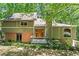 Charming home with an inviting front entrance and meticulously kept yard at 970 Pine Grove Pointe Dr, Roswell, GA 30075
