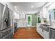 Modern kitchen with stainless appliances and shaker cabinets at 970 Pine Grove Pointe Dr, Roswell, GA 30075