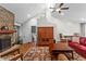 Comfortable living room featuring a stone fireplace and vaulted ceiling at 970 Pine Grove Pointe Dr, Roswell, GA 30075